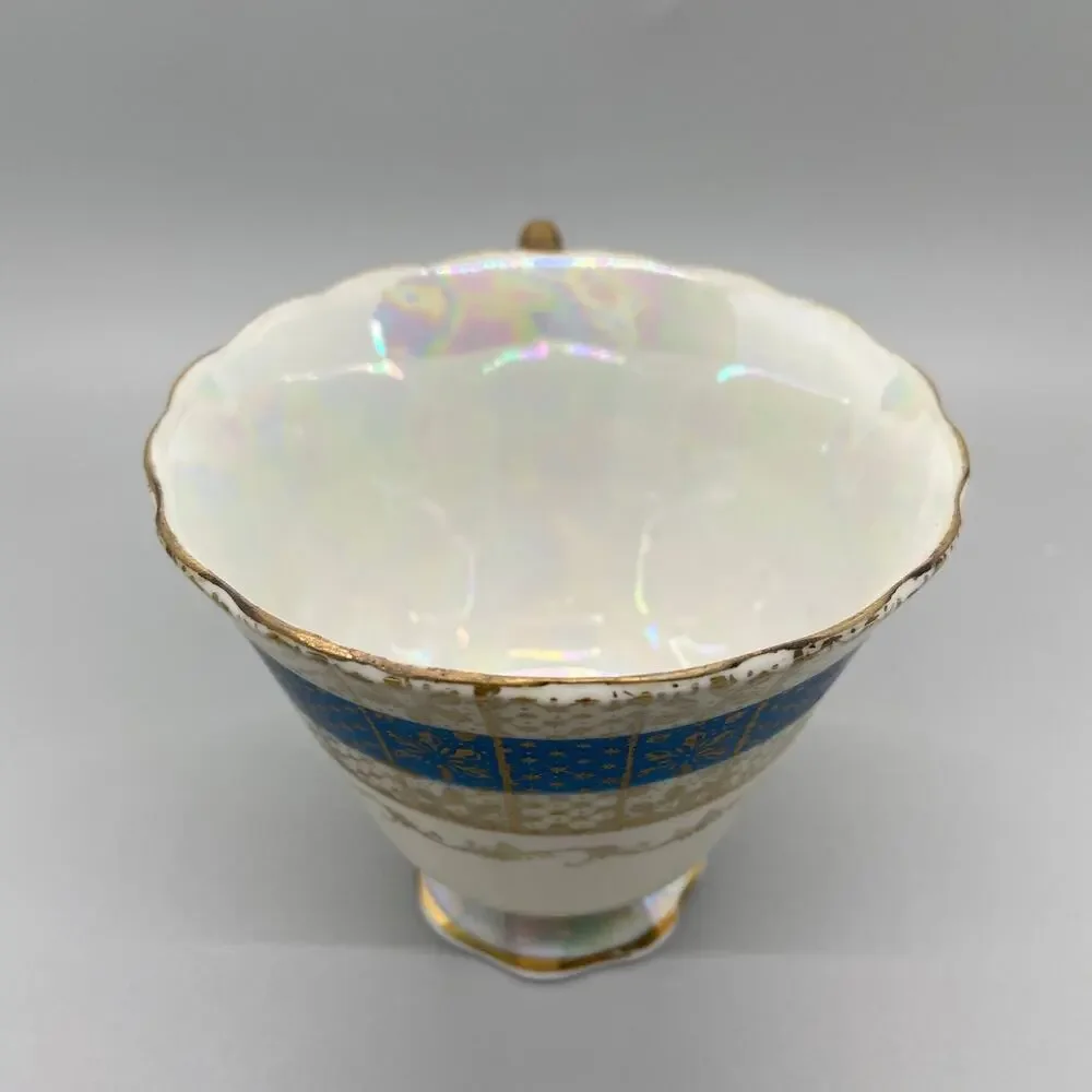 Vintage Porcelain Lusterware Tea Cup with Blue and Gold Toned Floral Design